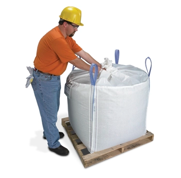 Super Sack with a spout top being closed. Super sacks are also commonly referred to as industrial packaging or bulk bags.